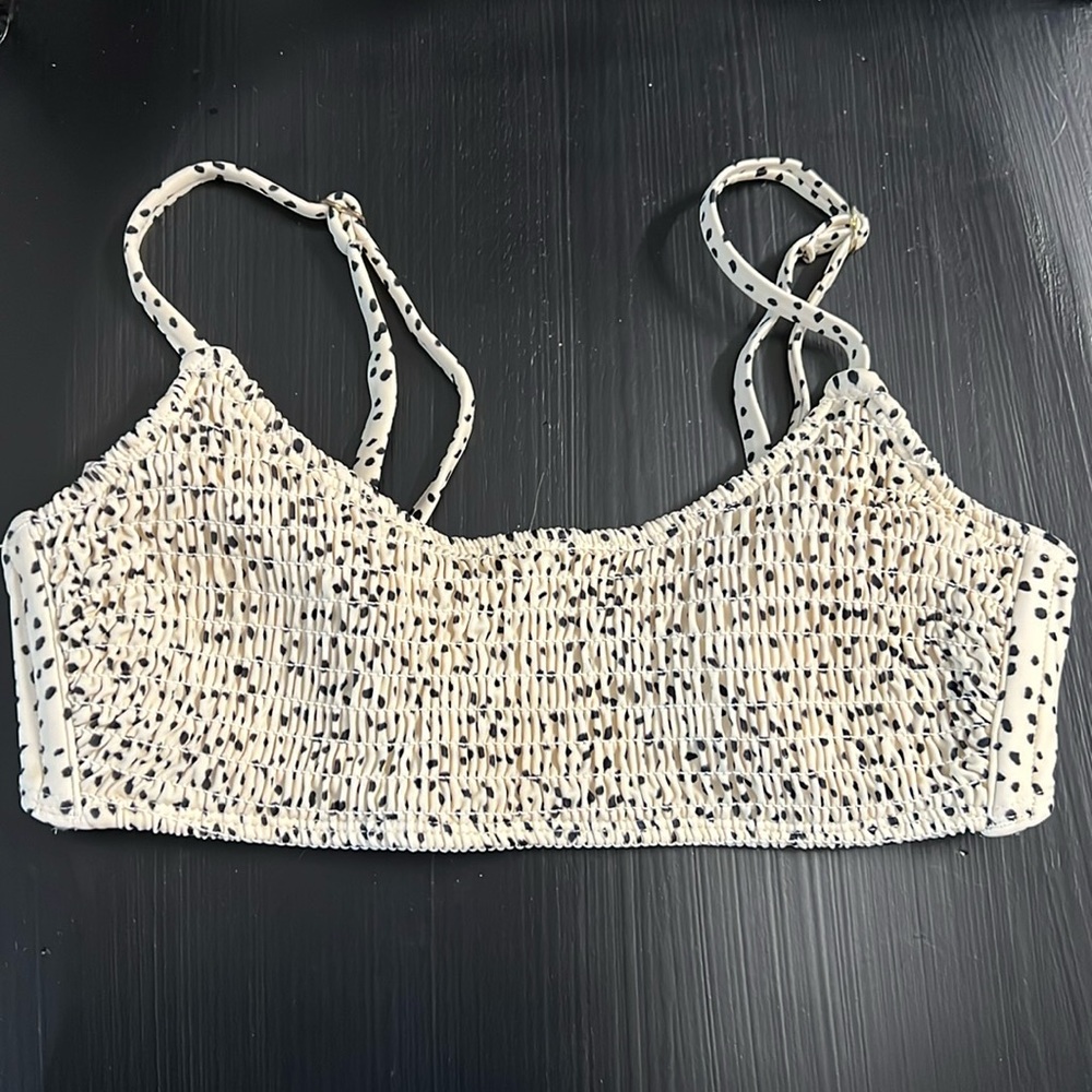 Xhiliration swim top. Size medium.  Cream with black dots. Lined.
